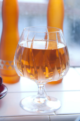 Lapsang Souchong tea in a fancy brandy-glass. Photographed in my kitchen.