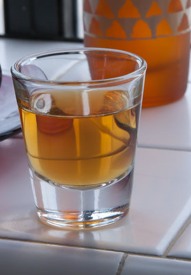 Shot glass with bourbon photograph (1/60th a second rendering, iso 400, F/22, 206mm lens (135x1.6)). Note the boundary between the liquid and the glass at the bottom. Discrepancies have more to do with the difficulty of getting an accurate thickness measurement at the bottom of the glass due to the size and taper. My poor calipers.